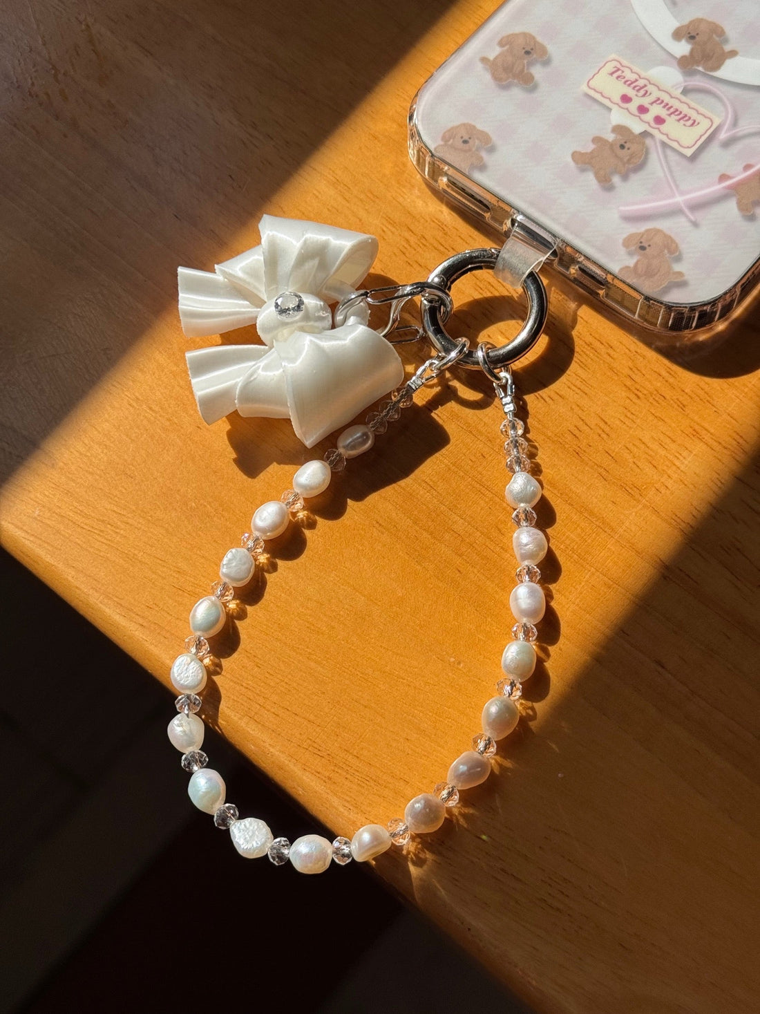 White Bow Pearl Phone Charm with freshwater pearls and cubic zirconia bow by UNICOLOOM