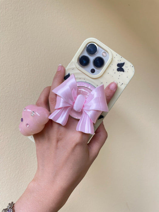 Silk Pink Bow Magnetic Phone Grip on a MagSafe-compatible iPhone case by UNICOLOOM