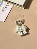 Bow Phone Charm in silk white and silk pink with cubic zirconia by UNICOLOOM