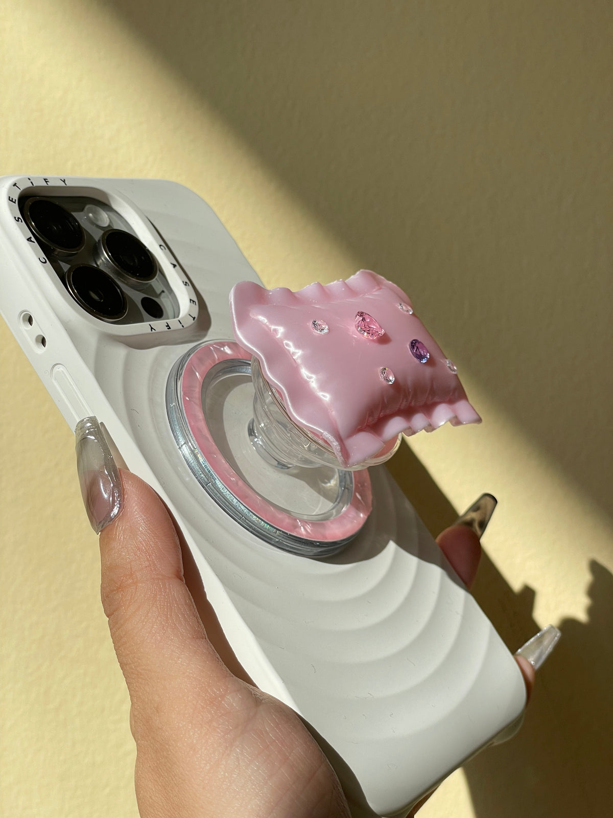 Pillow Phone Grip in hand, editorial styling