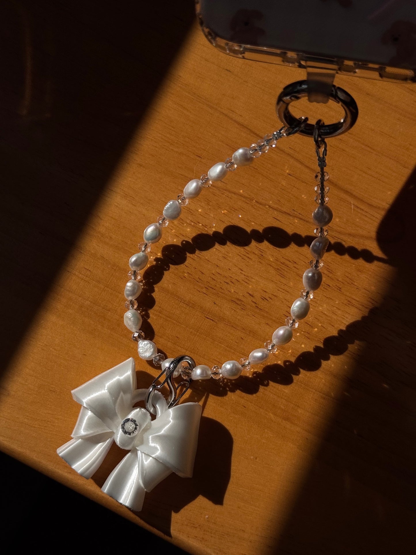 White Bow Pearl Phone Charm with freshwater pearls and cubic zirconia bow by UNICOLOOM