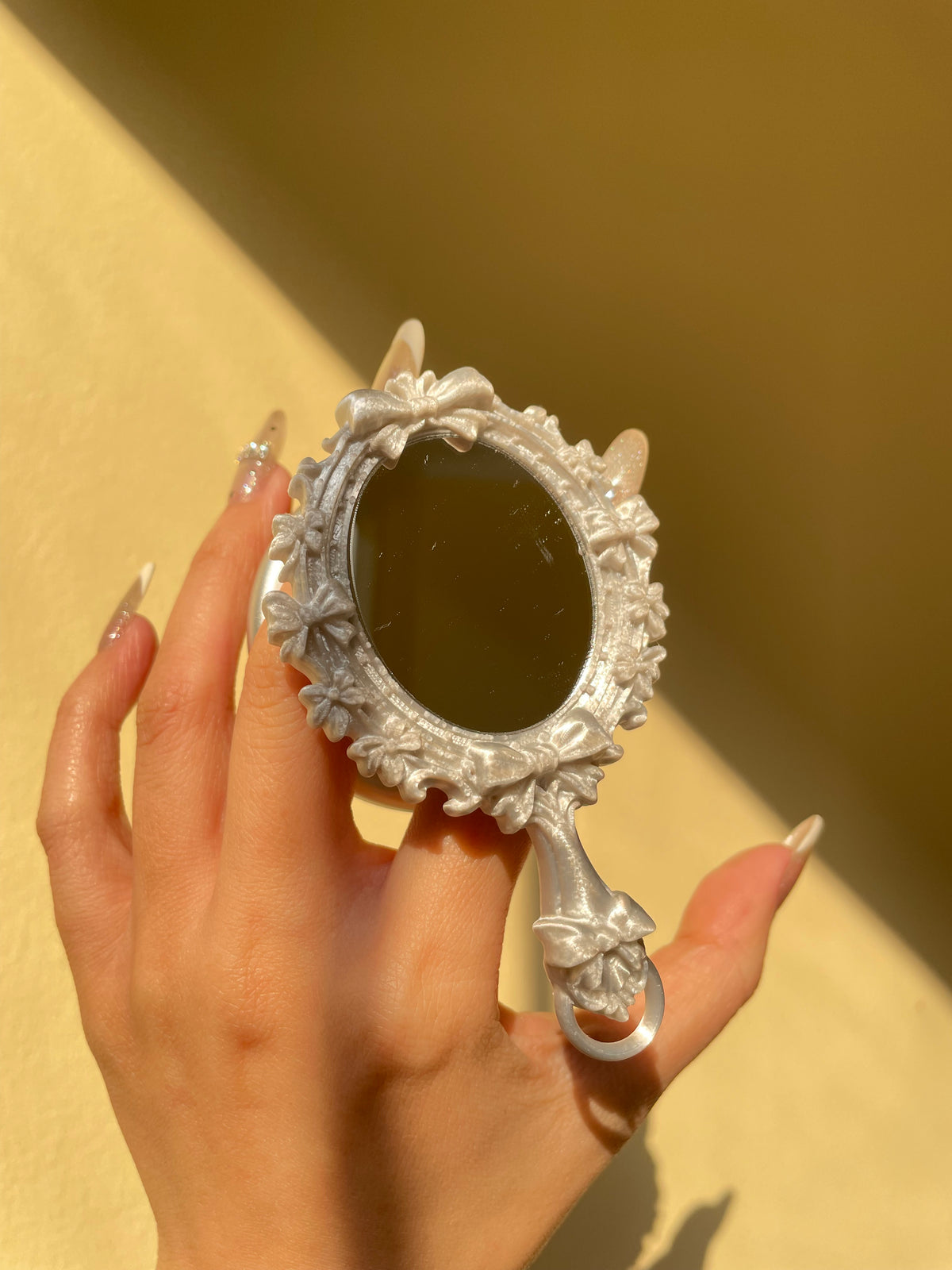 Mirror Bloom Phone Grip in hand, editorial styling