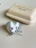 Mechanical Heart Ring worn on hand, front view