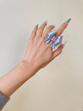 Silk Silver Ribbon Bow Ring worn on hand with pink cubic zirconia by UNICOLOOM