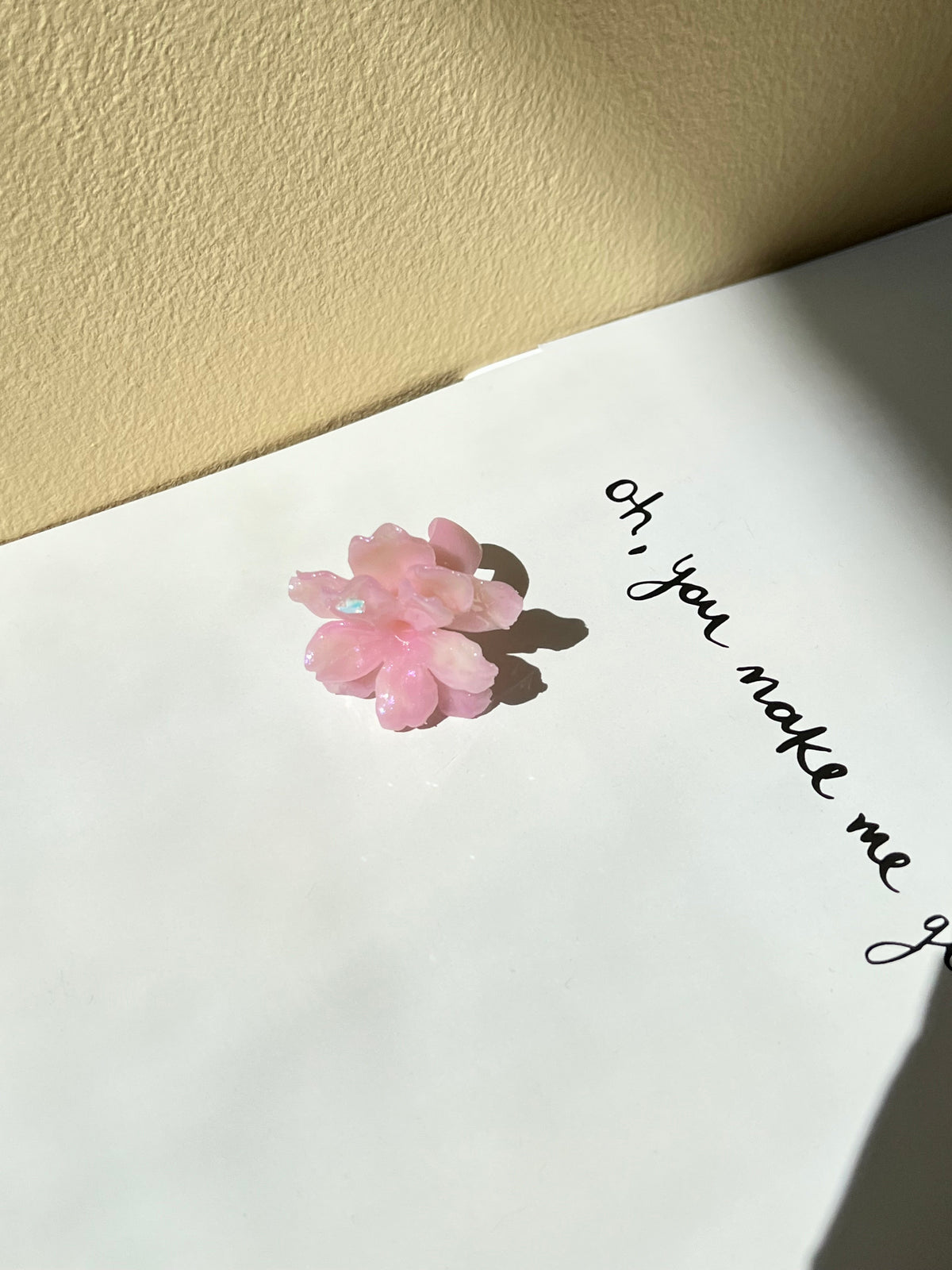 UV Sakura Ring worn on hand with floral detail