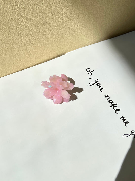 UV Sakura Ring worn on hand with floral detail