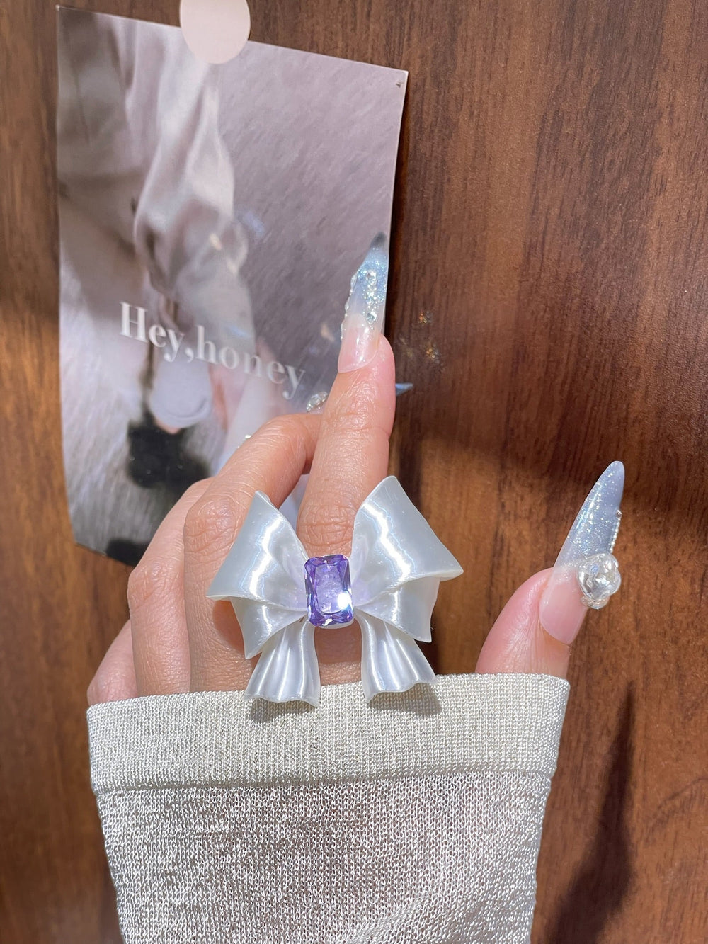 Silk Silver Ribbon Bow Ring close-up hand styling angle by UNICOLOOM