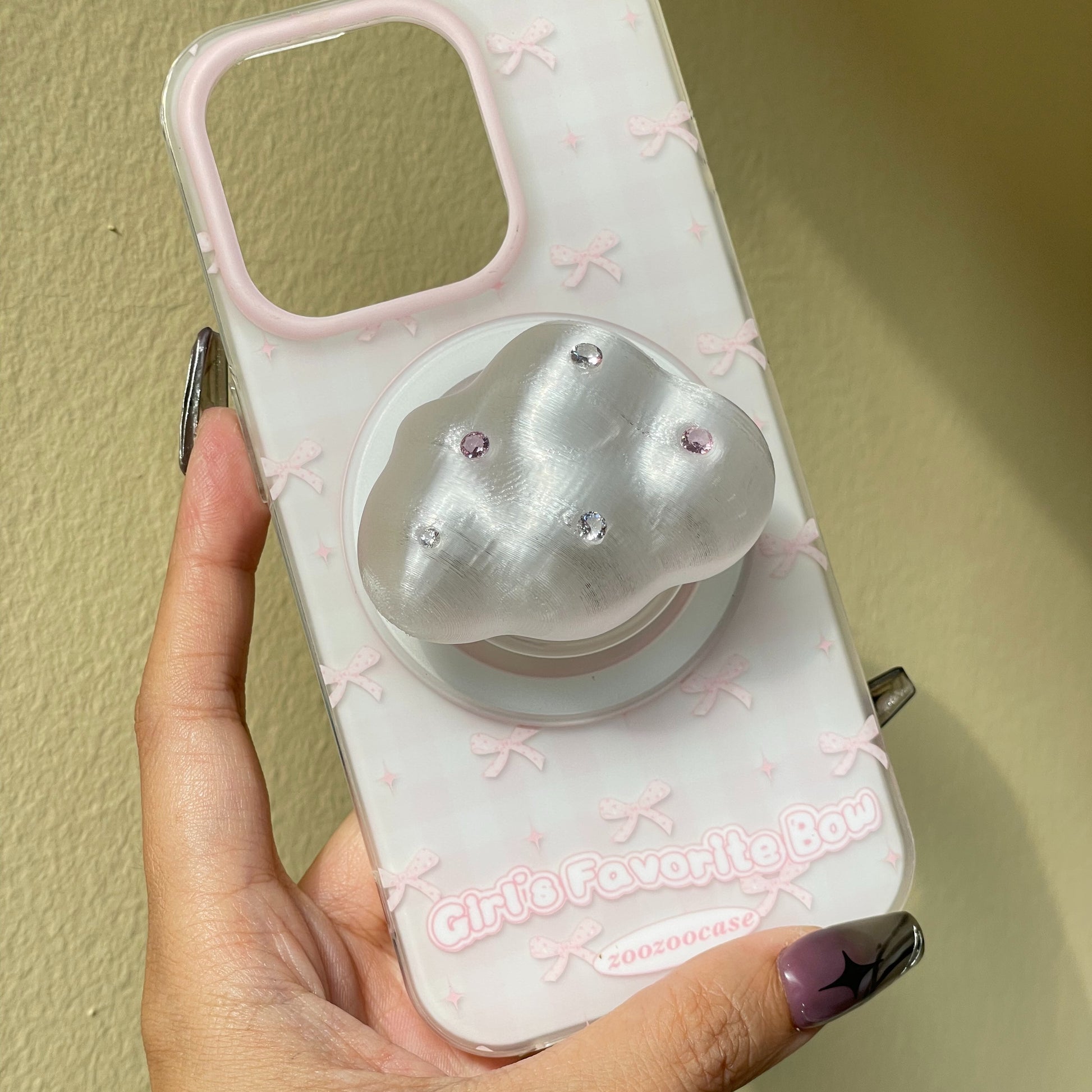 Cloud Magnetic Phone Grip attached to a MagSafe-compatible iPhone case