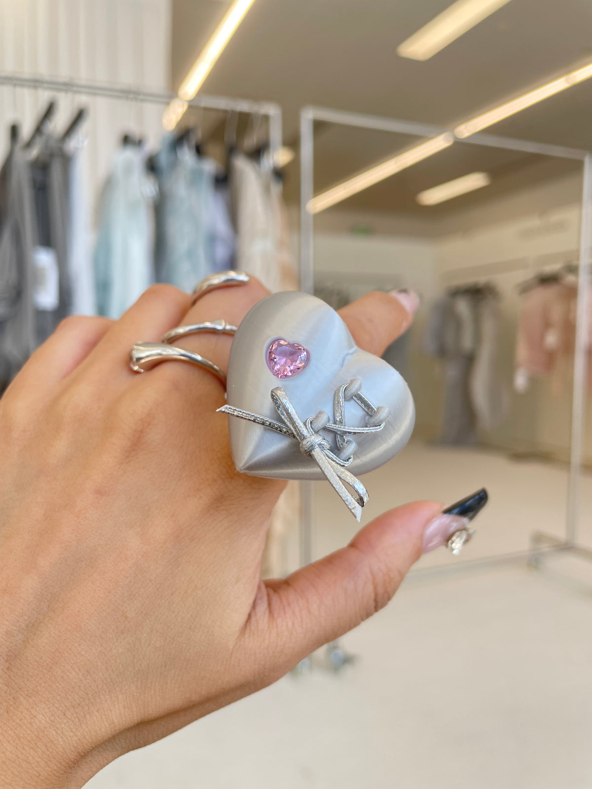Mechanical Heart Ring on neutral background