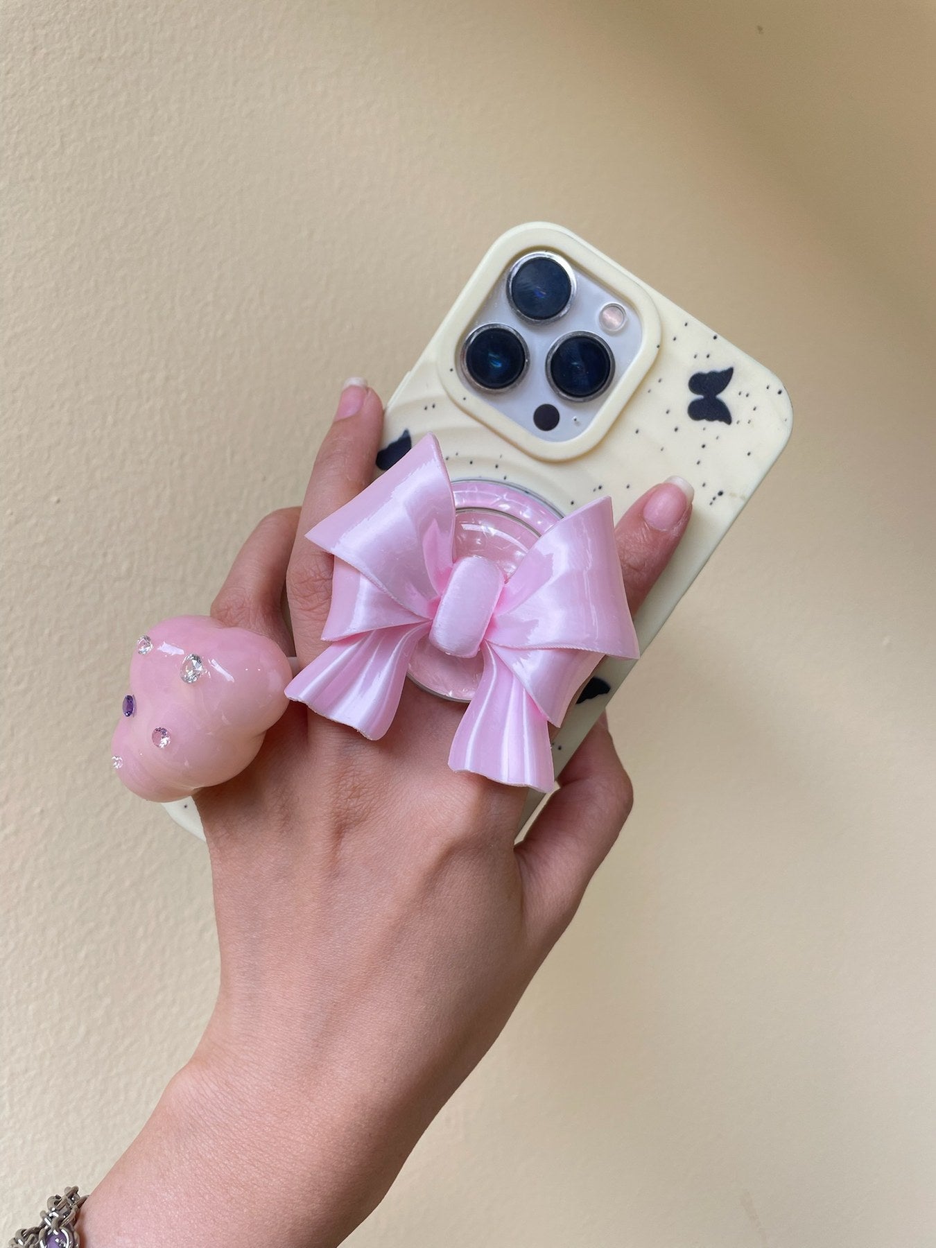 Silk Pink Bow Magnetic Phone Grip on a MagSafe-compatible iPhone case by UNICOLOOM