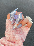 Silk Silver / Purple CZ Ribbon Bow Ring worn on hand by UNICOLOOM
