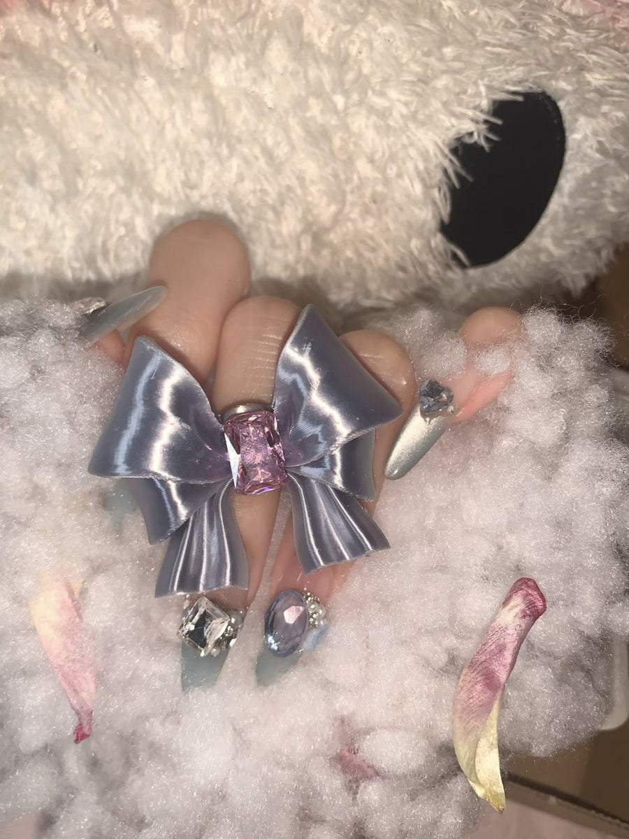 Silk Silver Ribbon Bow Ring with purple crystal worn on hand by UNICOLOOM